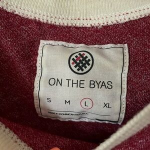 On the Byas Men’s 3/4 sleeve baseball tee. Large.